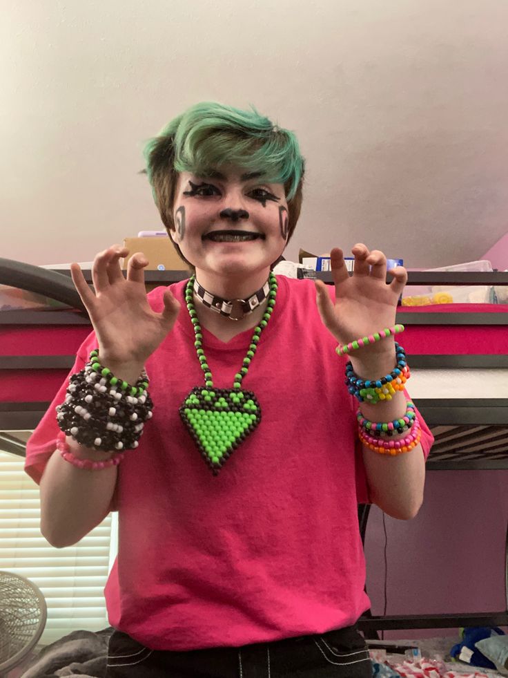 a person with green hair and face paint