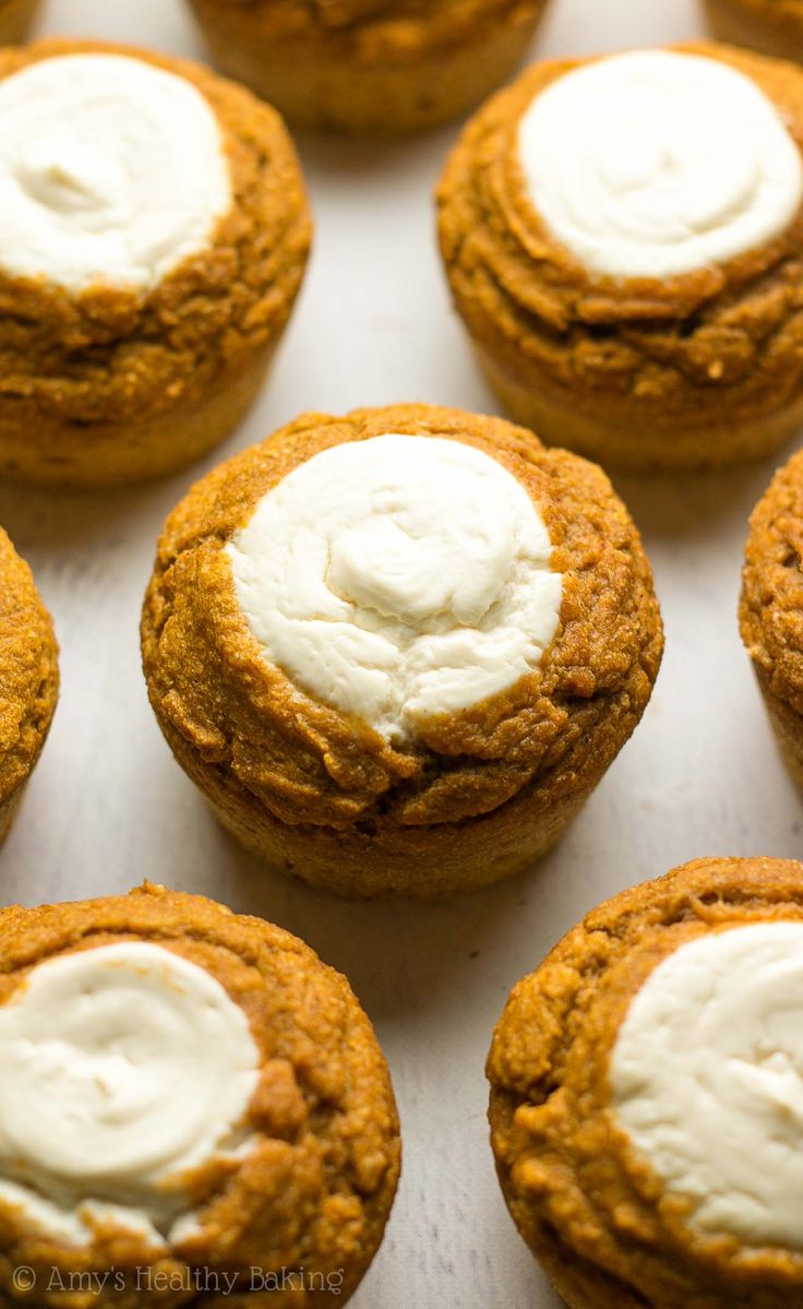 pumpkin spice cookies with cream cheese frosting on top