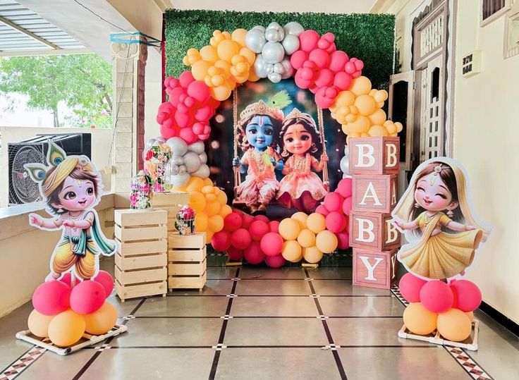 balloons and decorations are set up in the hallway for a baby's first birthday