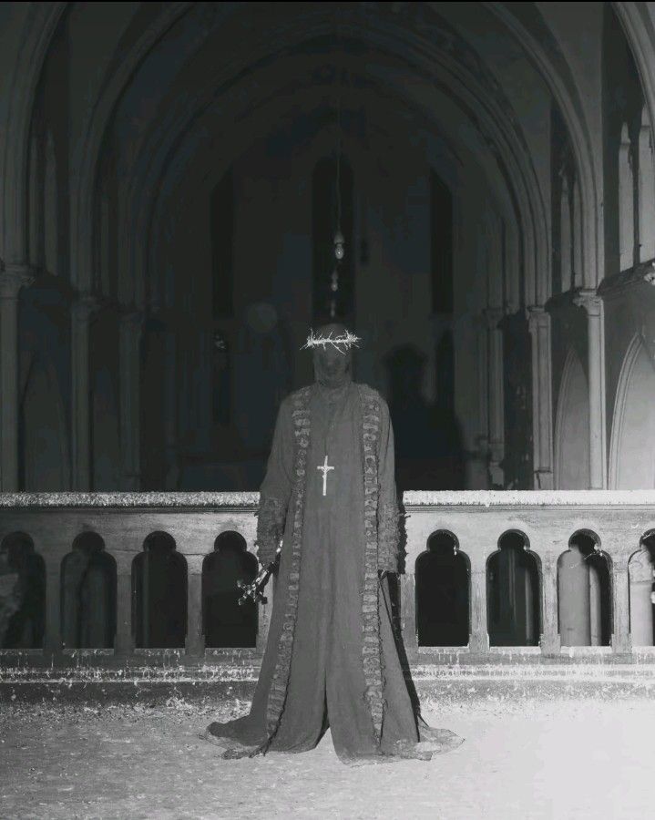 a man dressed in costume standing next to a building