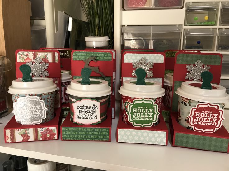 several christmas themed containers are stacked on top of each other