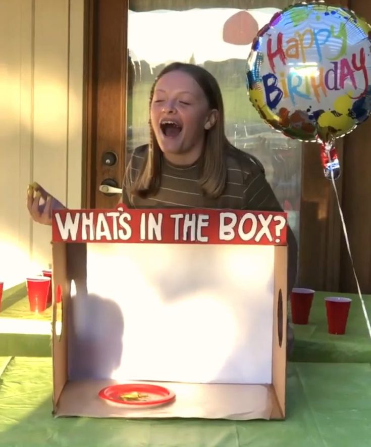 a woman in a box with the words whats in the box? on it