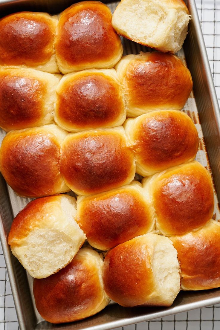 freshly baked bread rolls in a baking pan