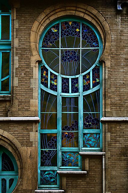 an old brick building with stained glass windows