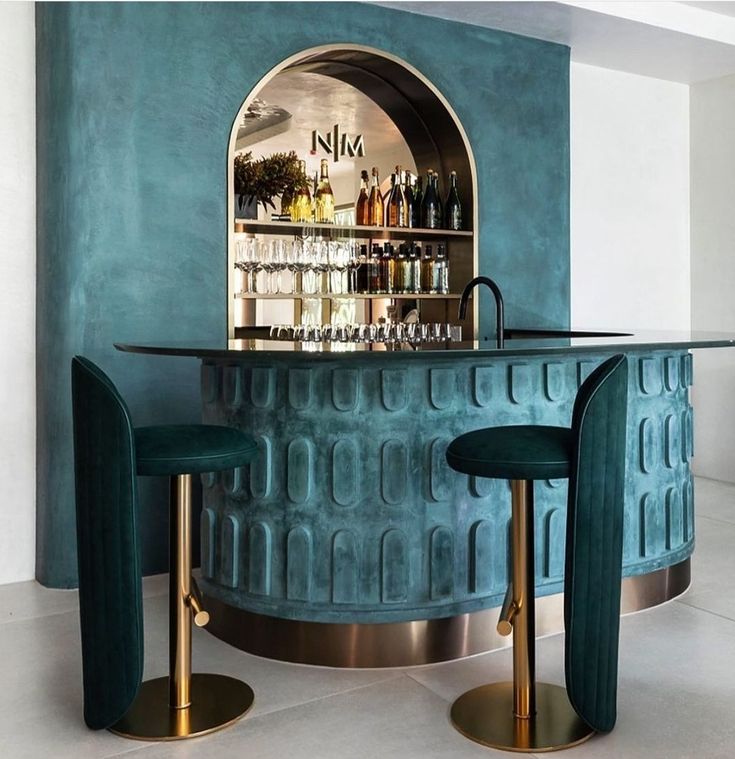 a bar with two stools next to it