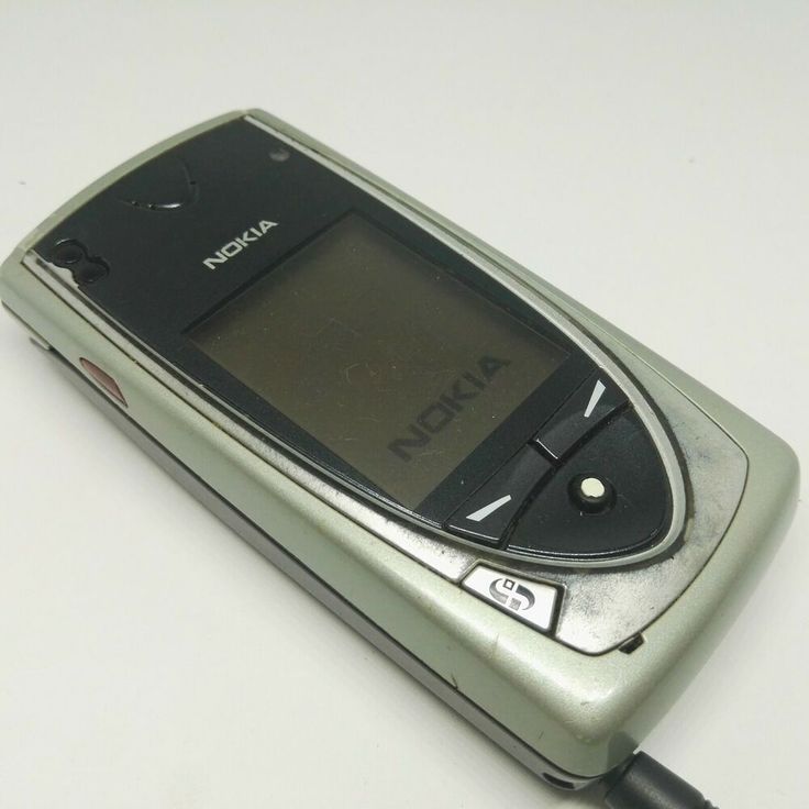 an old nokia cell phone sitting on a table