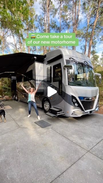 a woman standing in front of a motor home with her dog next to it and the words come take a tour of our new motorhome