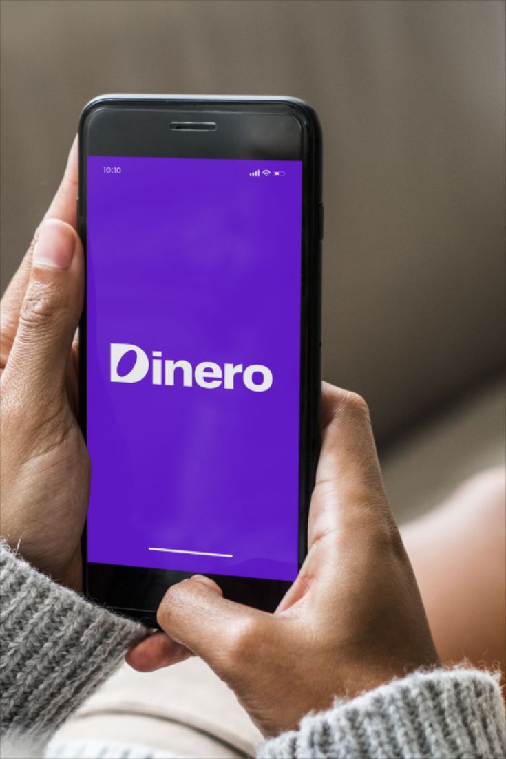 a person holding a cell phone with the word diner on it