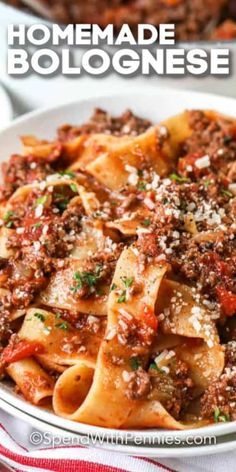 a bowl filled with homemade bolognzoe pasta and topped with parmesan cheese