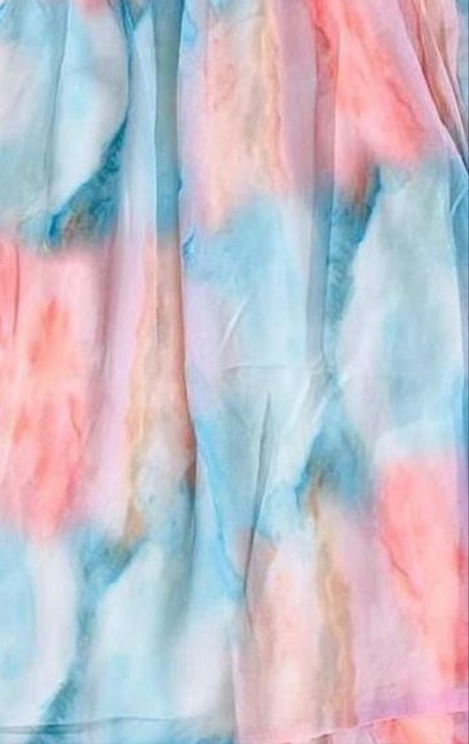 a tie dyed shirt with pastel colors on it