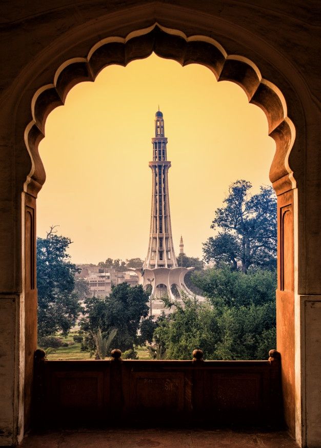 the eiffel tower is seen through an arch in this view from inside a building