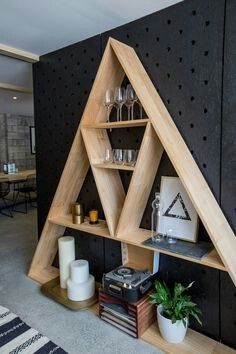 a wooden shelf with shelves on top of it