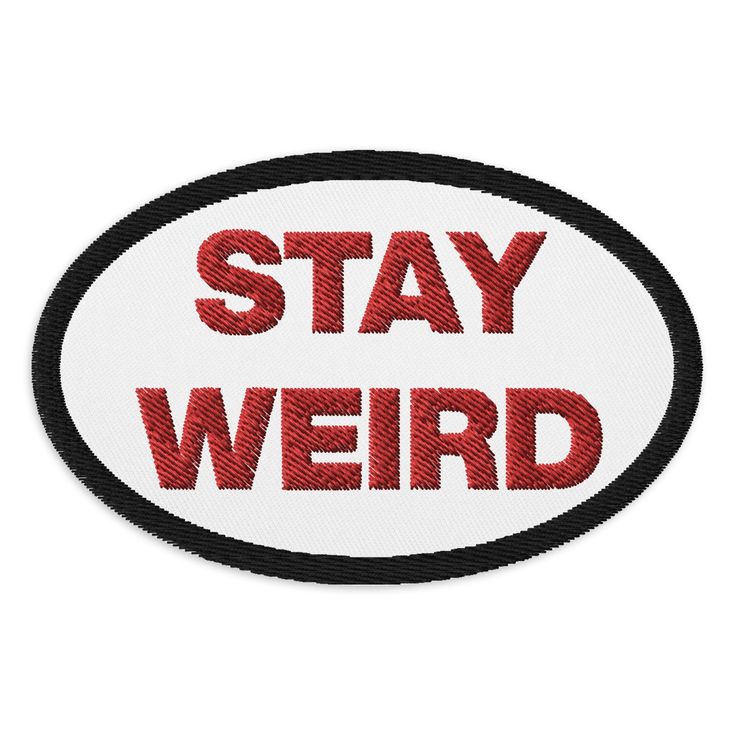 a red and black sticker that says stay weird on the back of a white oval