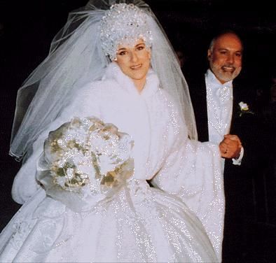 the bride and groom are dressed in white