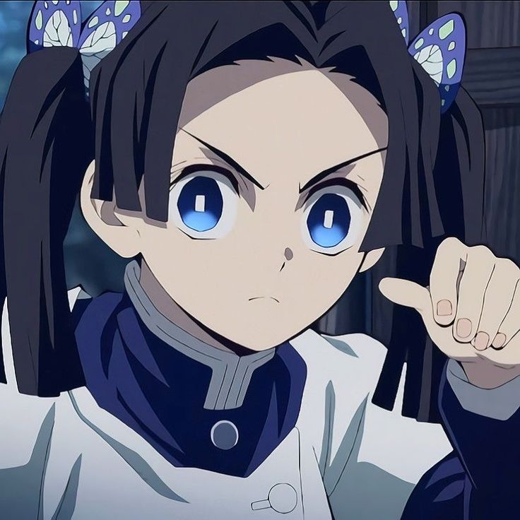 an anime character with blue eyes pointing to the side and holding her hand up in front of her face