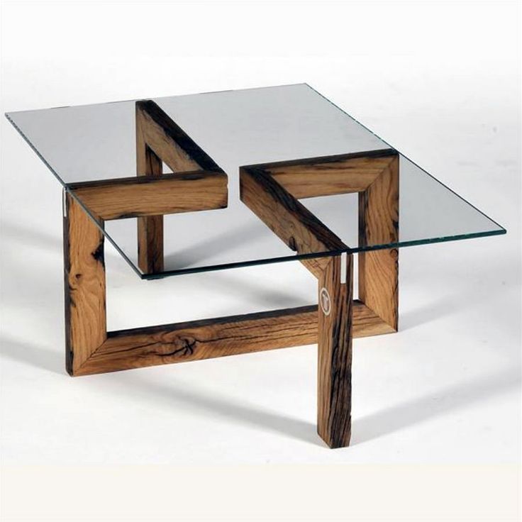 a wooden table with glass top and two pieces of wood on the bottom, sitting in front of a white background