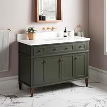 a bathroom with a sink, mirror and towel rack