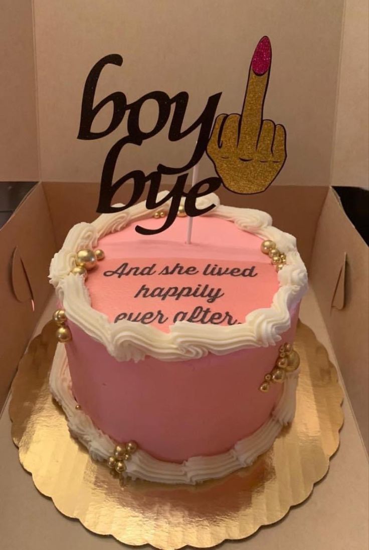 a pink and white birthday cake in a box with the words boy bye on it