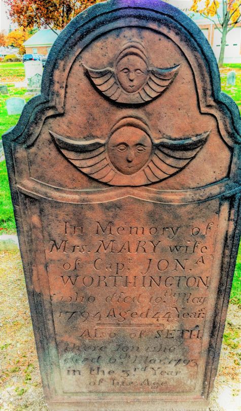 the headstone of an old cemetery with a sun and moon on it's face