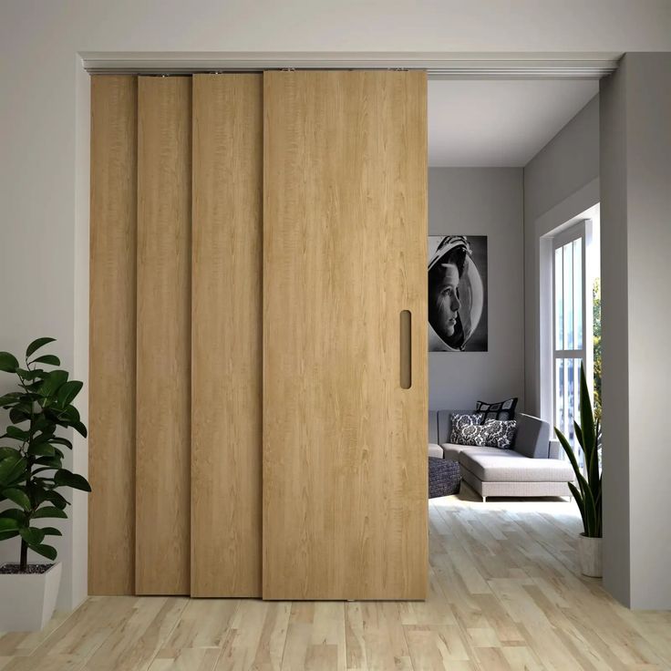 a living room with wood floors and sliding doors