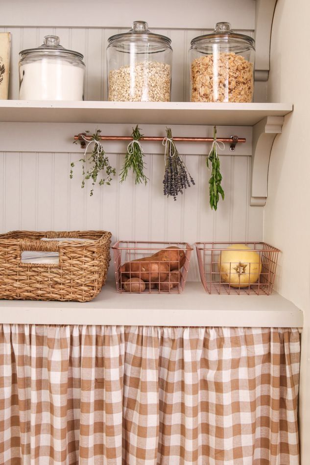 the shelves are filled with different types of food and containers on top of each shelf