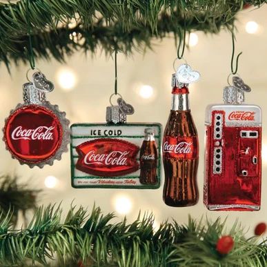 coca cola ornaments hanging from a christmas tree