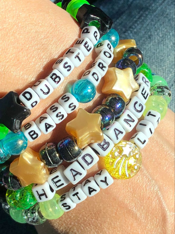 5 Dubstep themed Kandi beaded bracelets You will receive these exact bracelets *Dubstep *Headbanger *Stay Lit *Bass Drop *Pearly Gold Stars & Black Iridescent We make our Kandi bracelets using stretch string Available Sizes: OSFM 5 - 5.5 inches 5.5 - 6 inches 6 - 6.5 inches 6.5 - 7 inches 7 - 7.5 inches 7.5 - 8 inches 8 - 8.5 inches 8.5 - 9 inches Please send us a message to let us know what size bracelets you need. If you need a size not listed please contact us and we’ll be happy Alt Friendship Bracelet, Candy Bracelet Ideas Rave, Kandy Ideas Rave, Clay Beads Patterns, Festival Candy Bracelets, Candy Bracelets Rave, Candy Rave Bracelets, Cute Bracelet Making Ideas, Club Rave Outfit