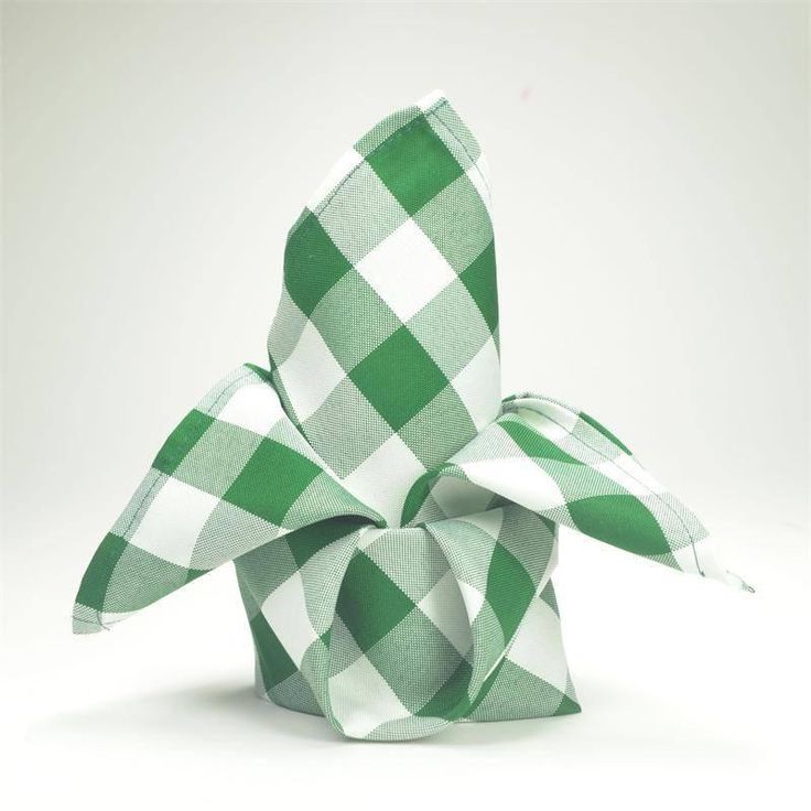 a green and white checkered bow on a white background