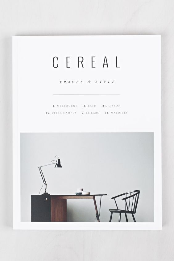 the cover of cereal magazine featuring a desk with a chair and lamp on it, against a white wall