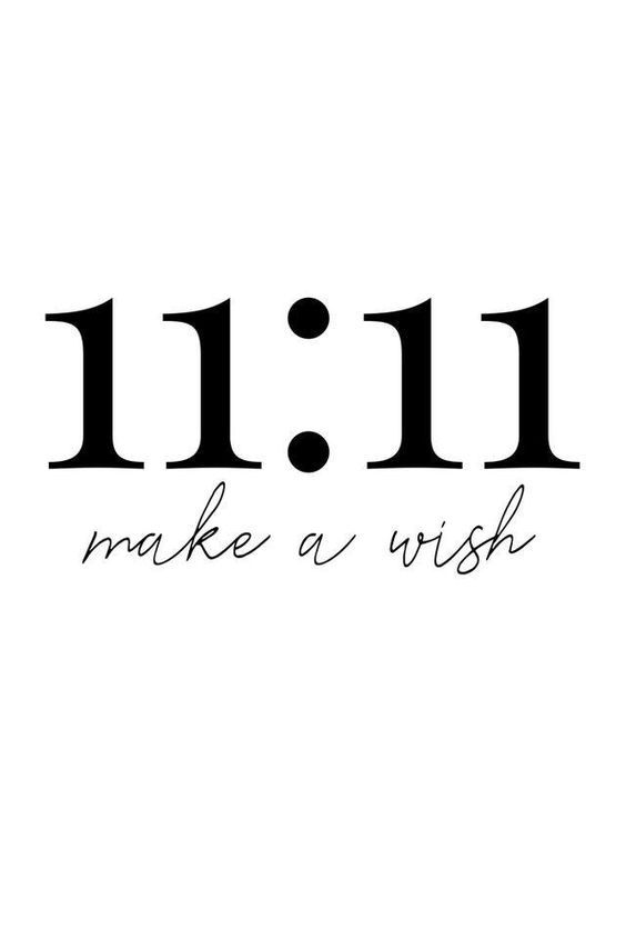 the words 11 11 make a wish written in black ink