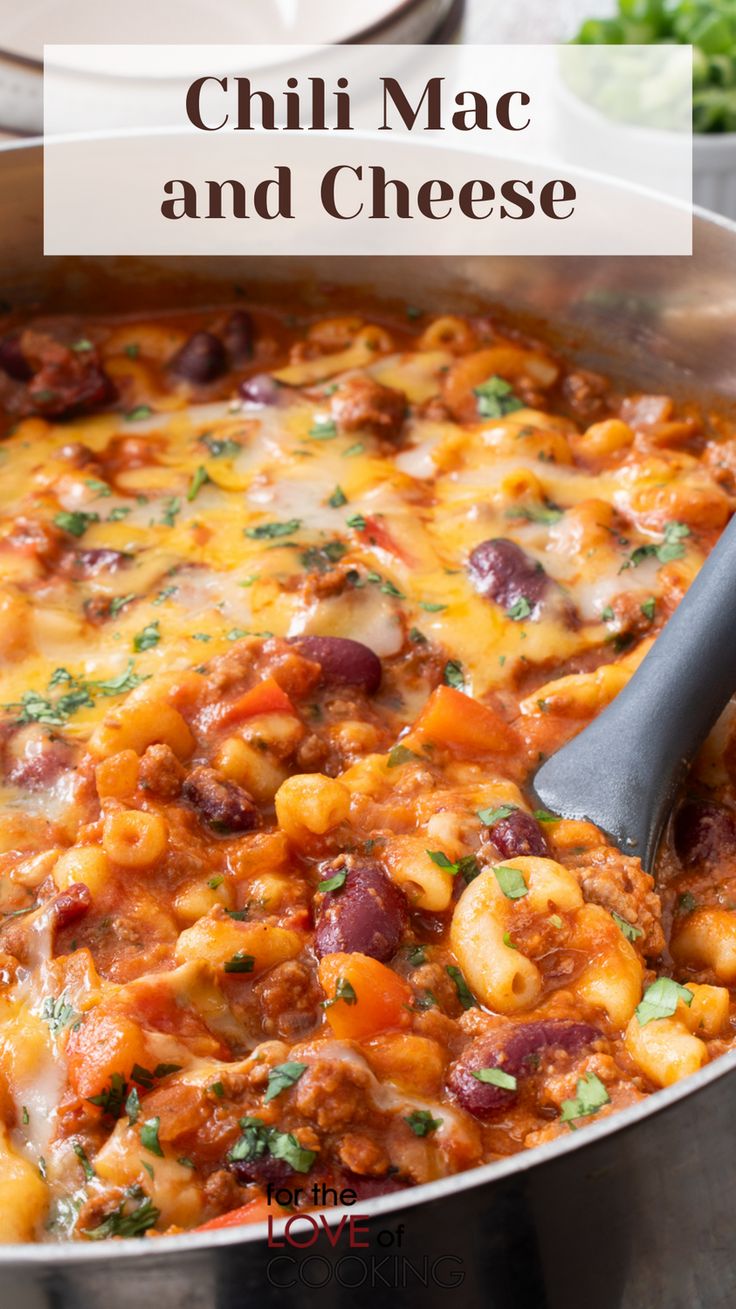 chili mac and cheese in a skillet with a ladle scooping up some food