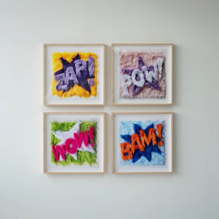 four framed art pieces with the words pow and now spelled in different colors on them