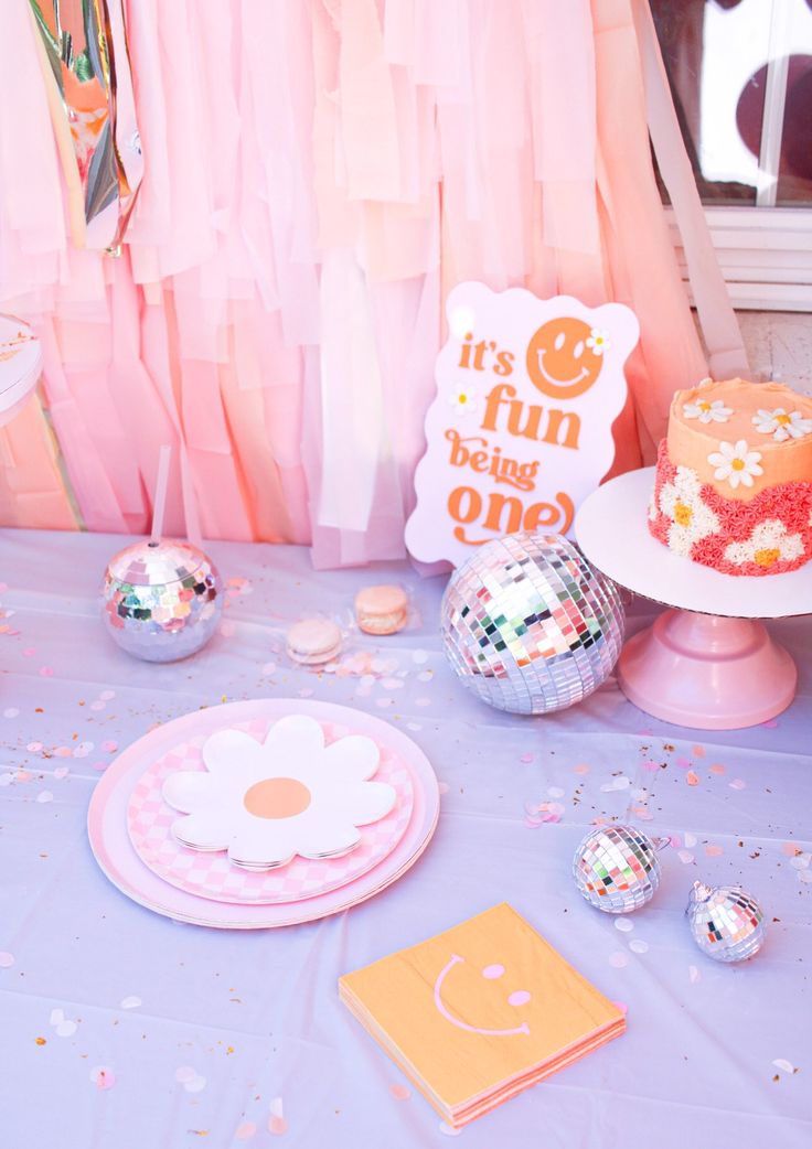 a table topped with lots of cake and confetti