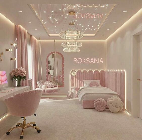 a bedroom decorated in pink and white with a chandelier hanging from the ceiling