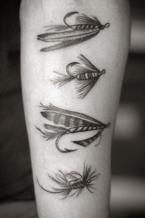 a black and white photo of three different types of feathers on the leg, one with an arrow