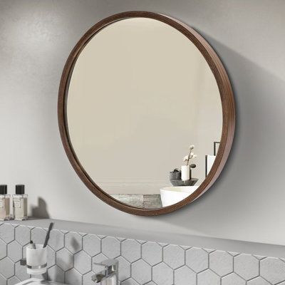 a bathroom sink with a mirror above it