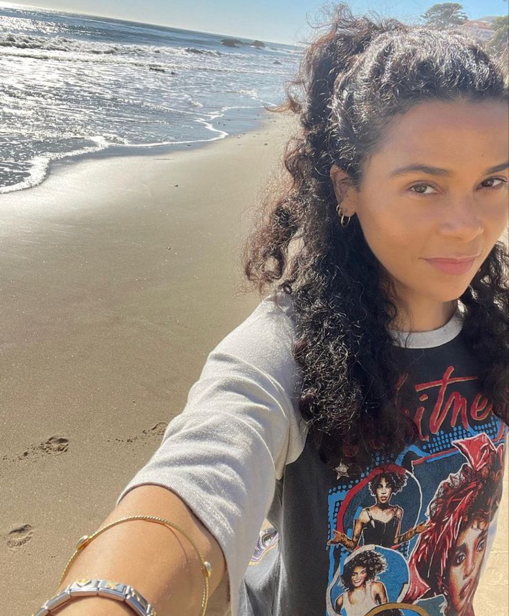 a woman taking a selfie on the beach