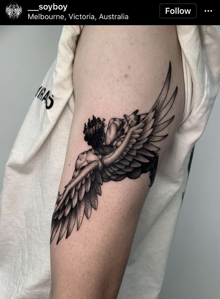 a woman's arm with an angel tattoo on it