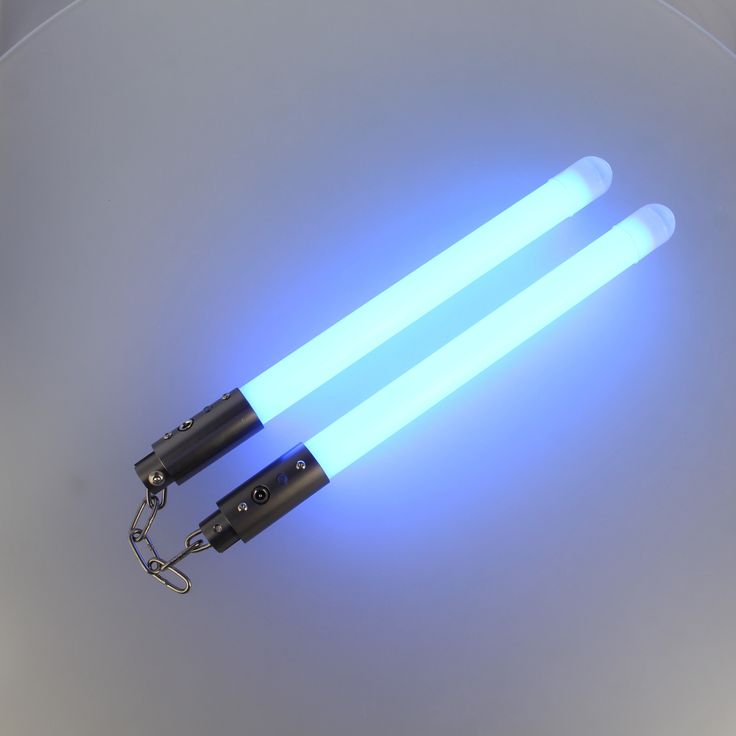 two blue lightsabes are attached to a metal object with a keychain