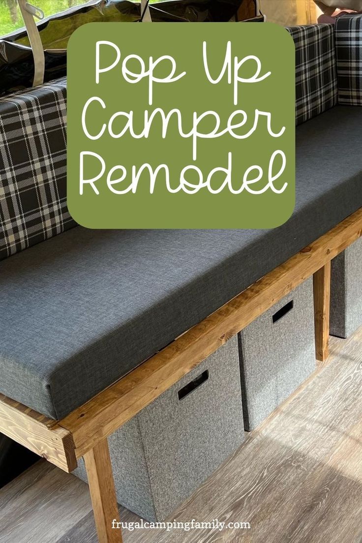 a bench with storage bins underneath it and the words pop up camper remodel above it