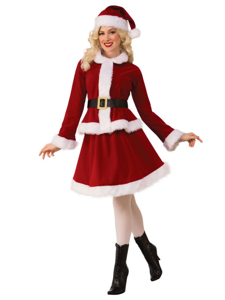 a woman dressed in a santa claus costume posing for the camera with her hands out