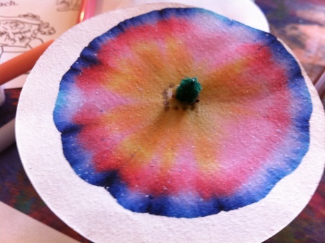 a close up of a paper plate with a flower on it