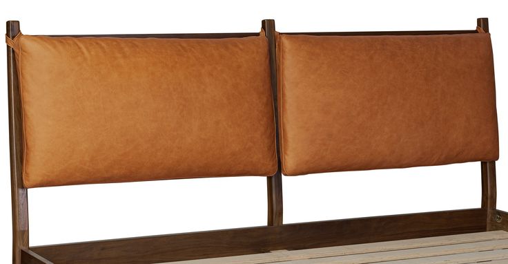 two brown leather headboards sitting next to each other