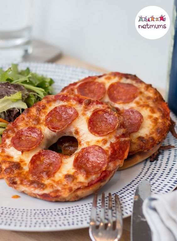 a pepperoni pizza and salad on a plate