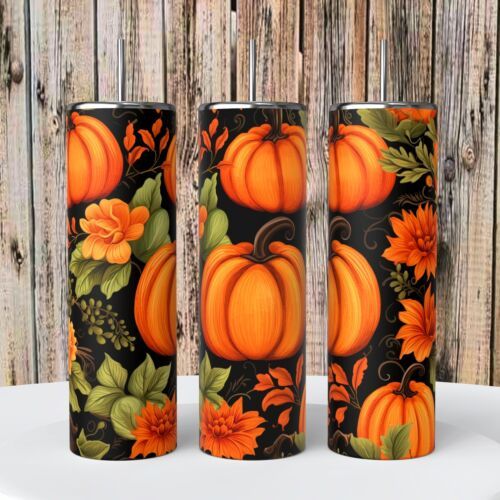 three pumpkins painted on black and orange with flowers, leaves and vines are sitting next to each other