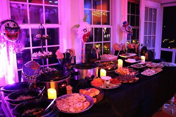 a table filled with lots of food and candles