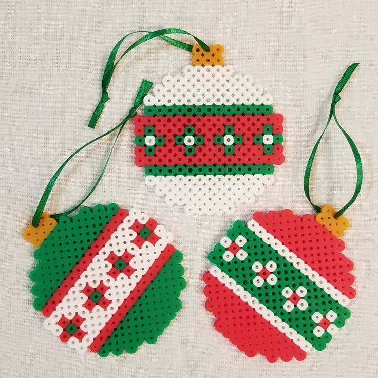 two christmas ornaments made out of perler beads