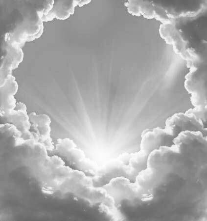 the sun shining through clouds in a black and white photo