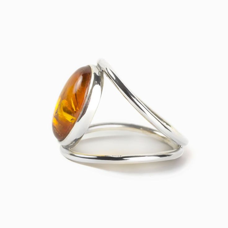 Amber Ring on Model Oval Citrine Ring With Spiritual Style, Spiritual Oval Citrine Ring, Minimalist Amber Ring Jewelry, Modern Amber Jewelry With Natural Stones, Modern Amber Jewelry For Anniversary, Spiritual Amber Citrine Rings, Modern Amber Oval Ring, Adjustable Amber Cabochon Rings, Amber Rings With Natural Stones