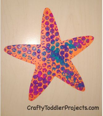 an orange and pink starfish with bubbles on it